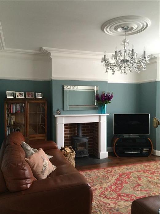 A living room decorated in Oval Room Blue by Farrow & Ball